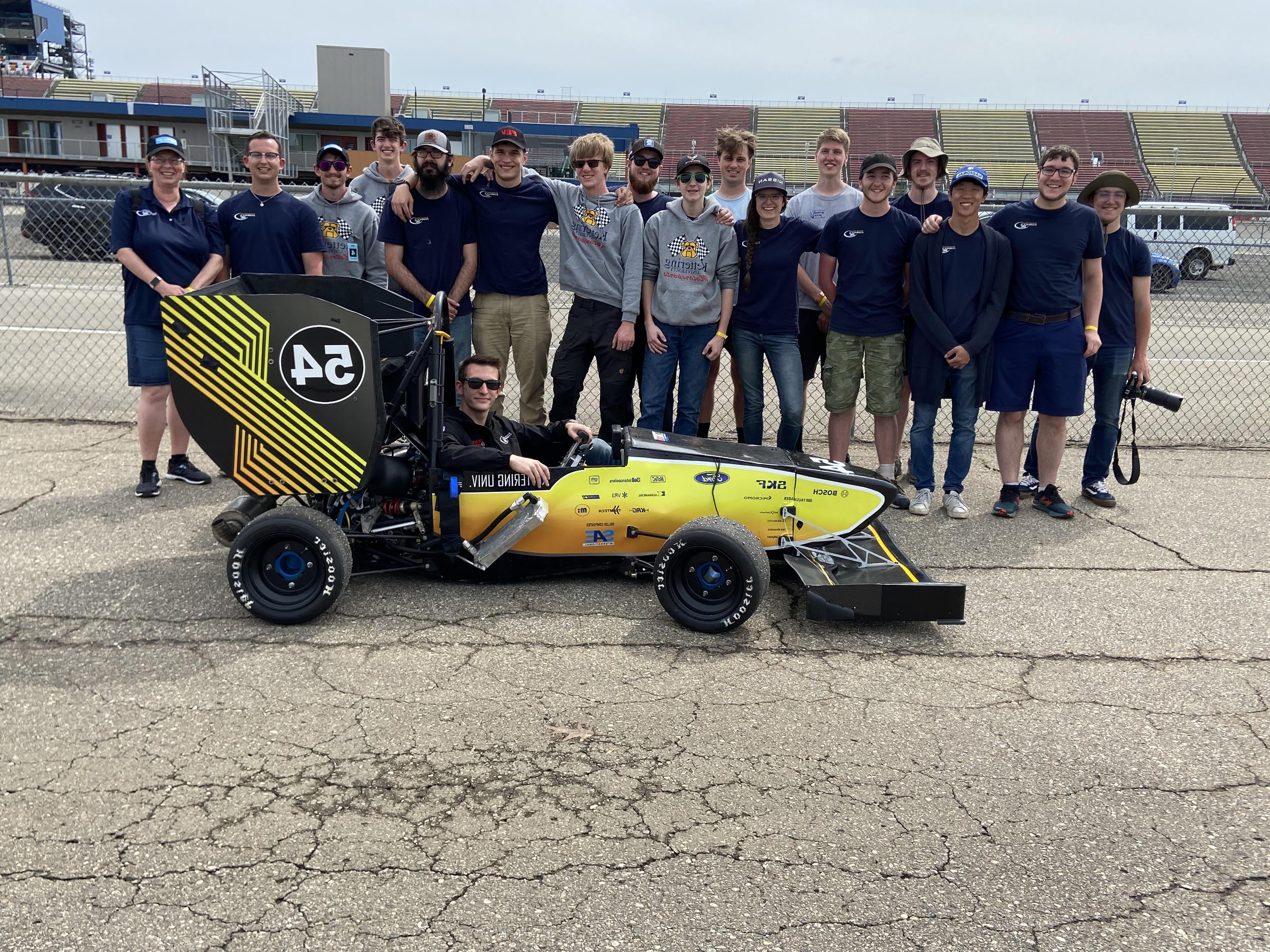 正规的赌博app's 公式SAE team poses with its car.